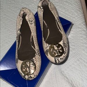 Tory Burch Black and Gold Flats with Medallion